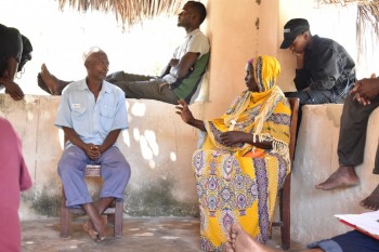Figure 4. Community elders discussing aspects of the Songo Mnara site (Photo credit Ashley Fisher).  Picha 4: Wazee wa kijiji wakijadili  kuhusu umuhimu wa  site ya Songo Mnara (Picha, Ashley Fisher).